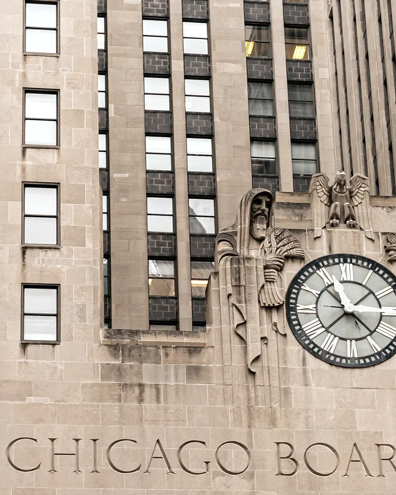 The Chicago Board of Trade: carved stone lettering beneath an art deco clock and sculpted figures.