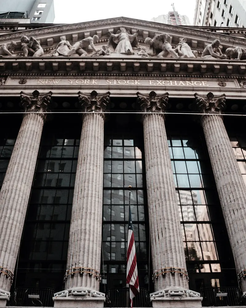 The New York Stock Exchange: a row of fluted stone columns beneath a carved pediment.